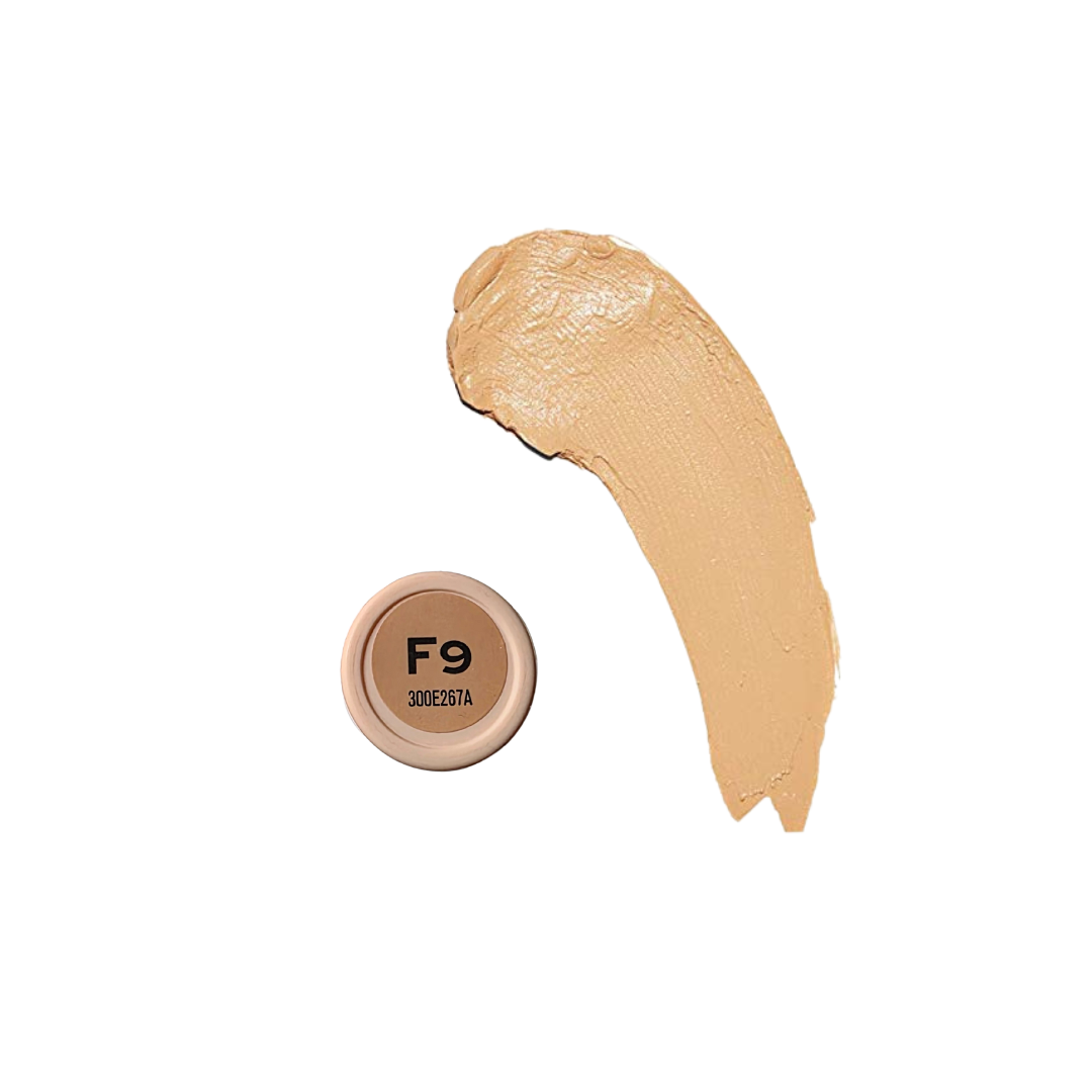 Revolution Fast Base Stick Foundation in a sleek tube, showcasing its creamy texture and natural shade for flawless coverage.