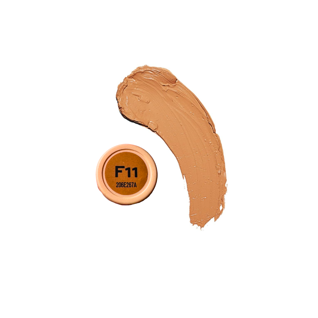 Revolution Fast Base Stick Foundation in a sleek stick format, showcasing its creamy texture and natural color.