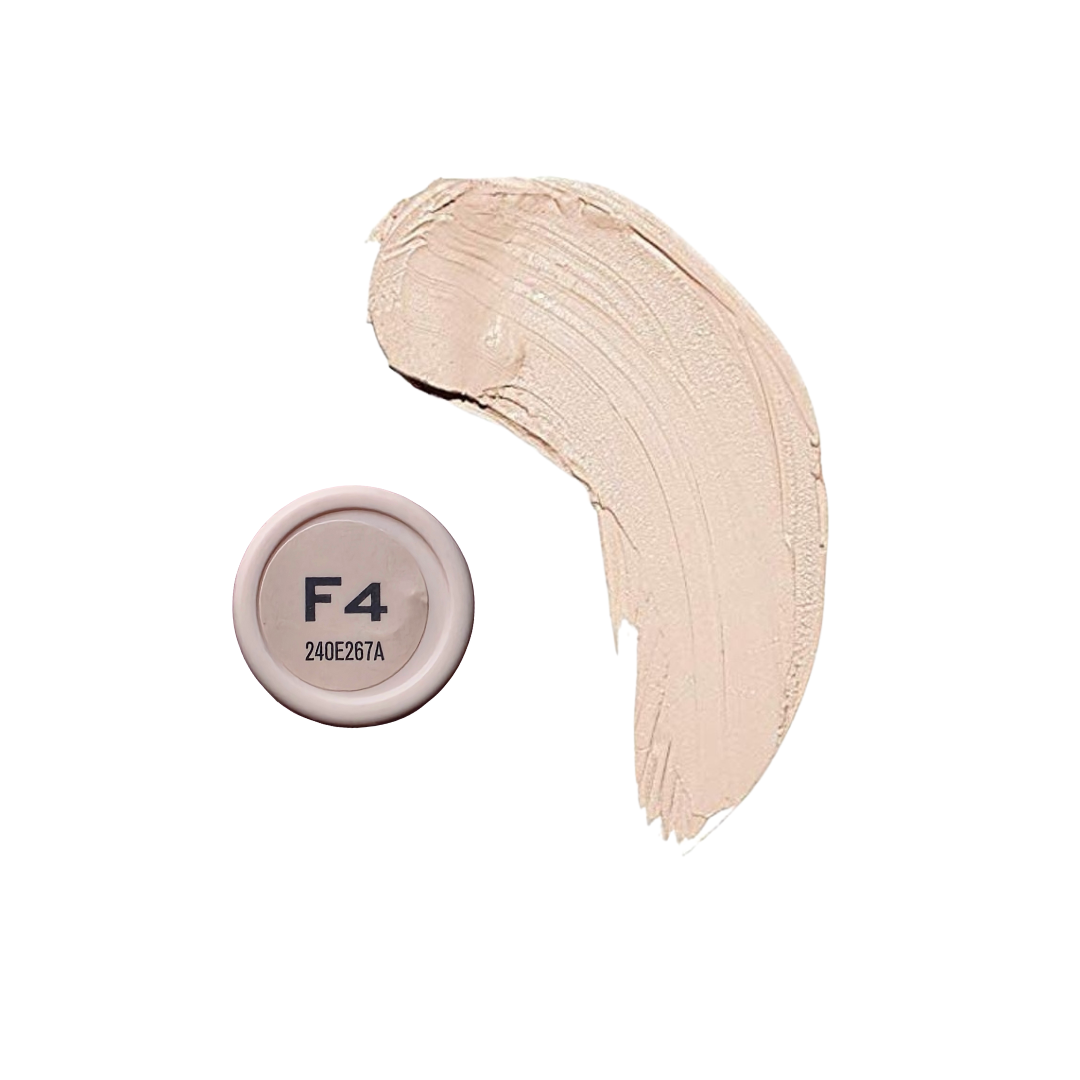 Revolution Fast Base Stick Foundation in a sleek tube, showcasing its smooth texture and rich color on a white background.