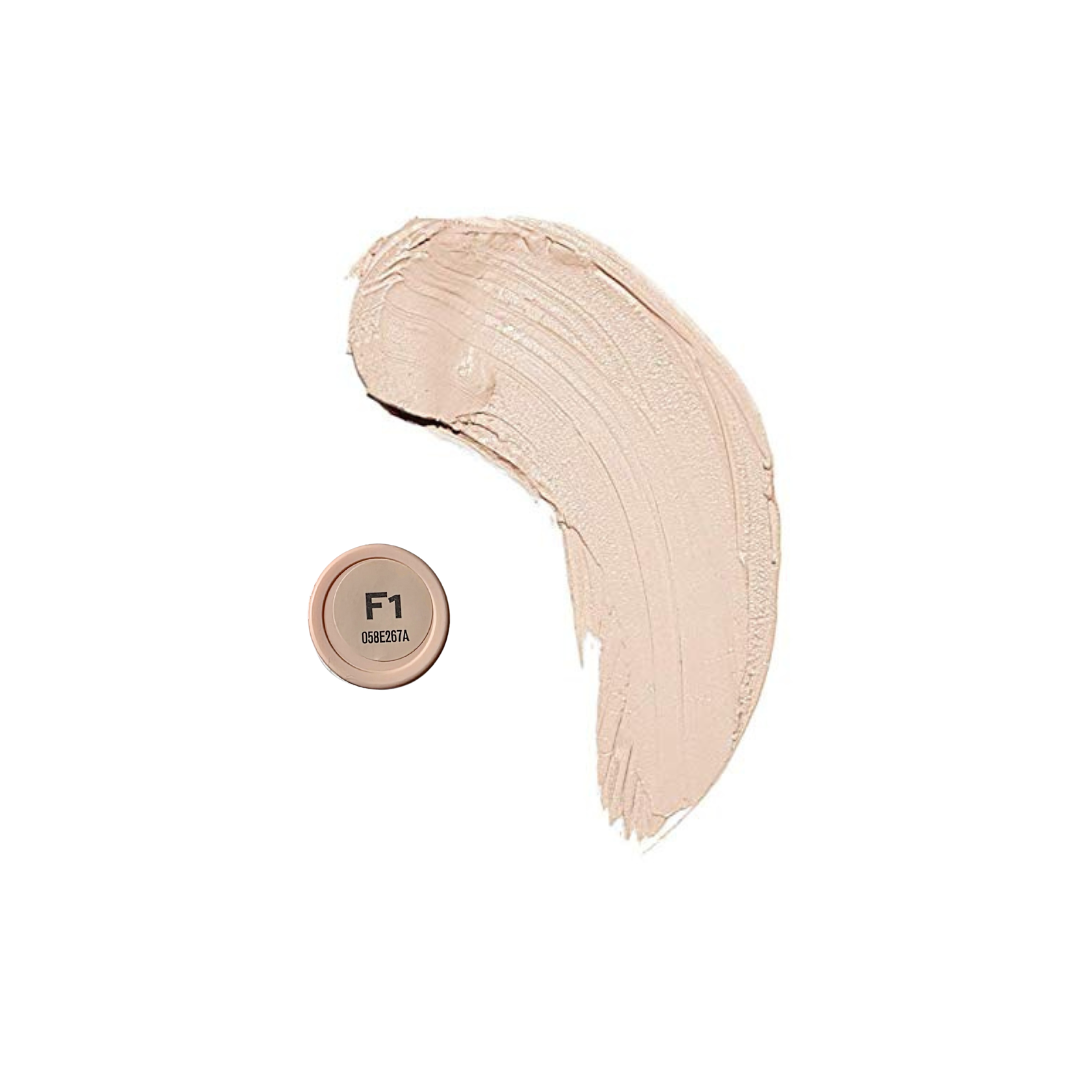 Revolution Fast Base Stick Foundation in a sleek tube, showcasing its creamy texture and rich color for flawless coverage.