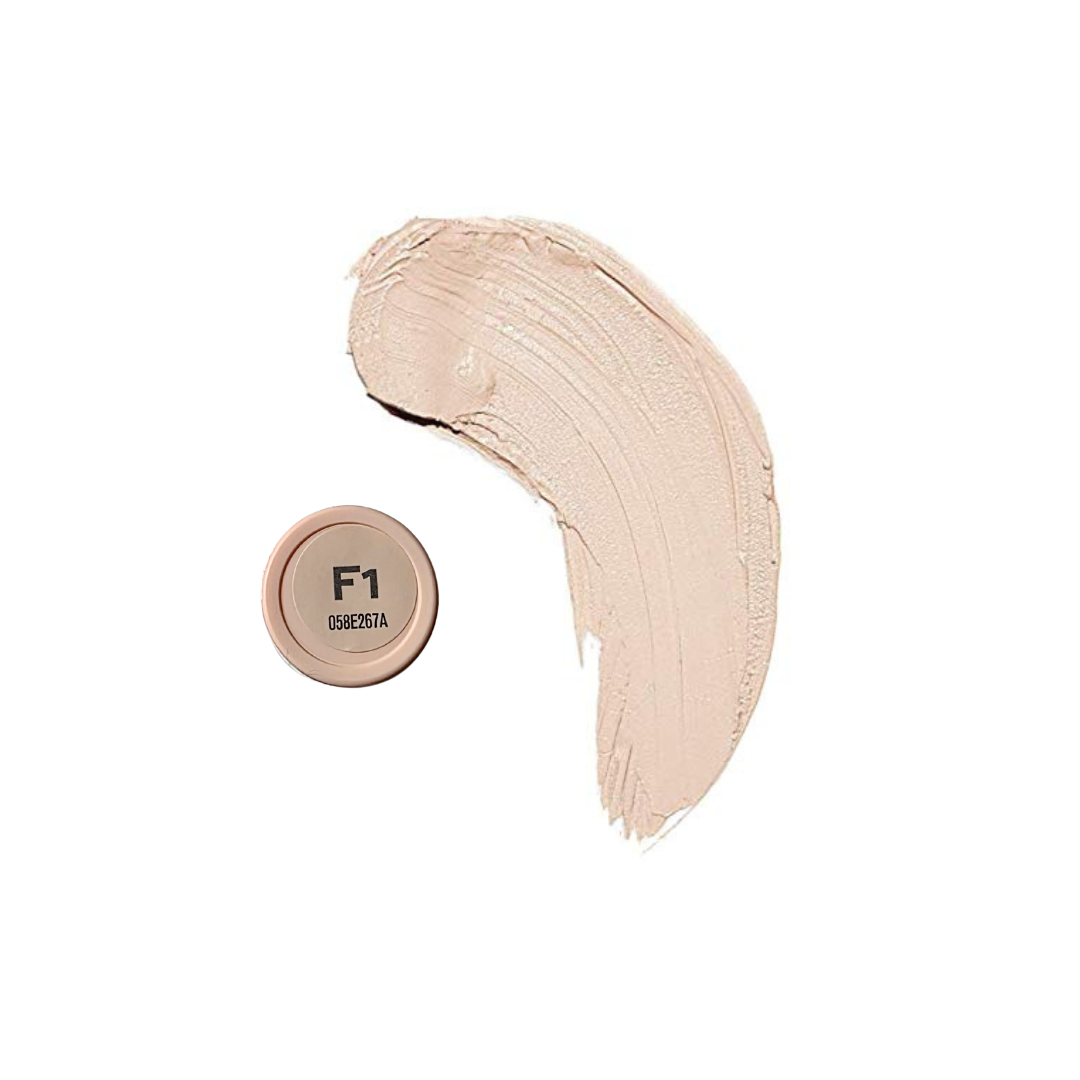 Revolution Fast Base Stick Foundation in a sleek tube, showcasing the creamy texture and lightweight formula.