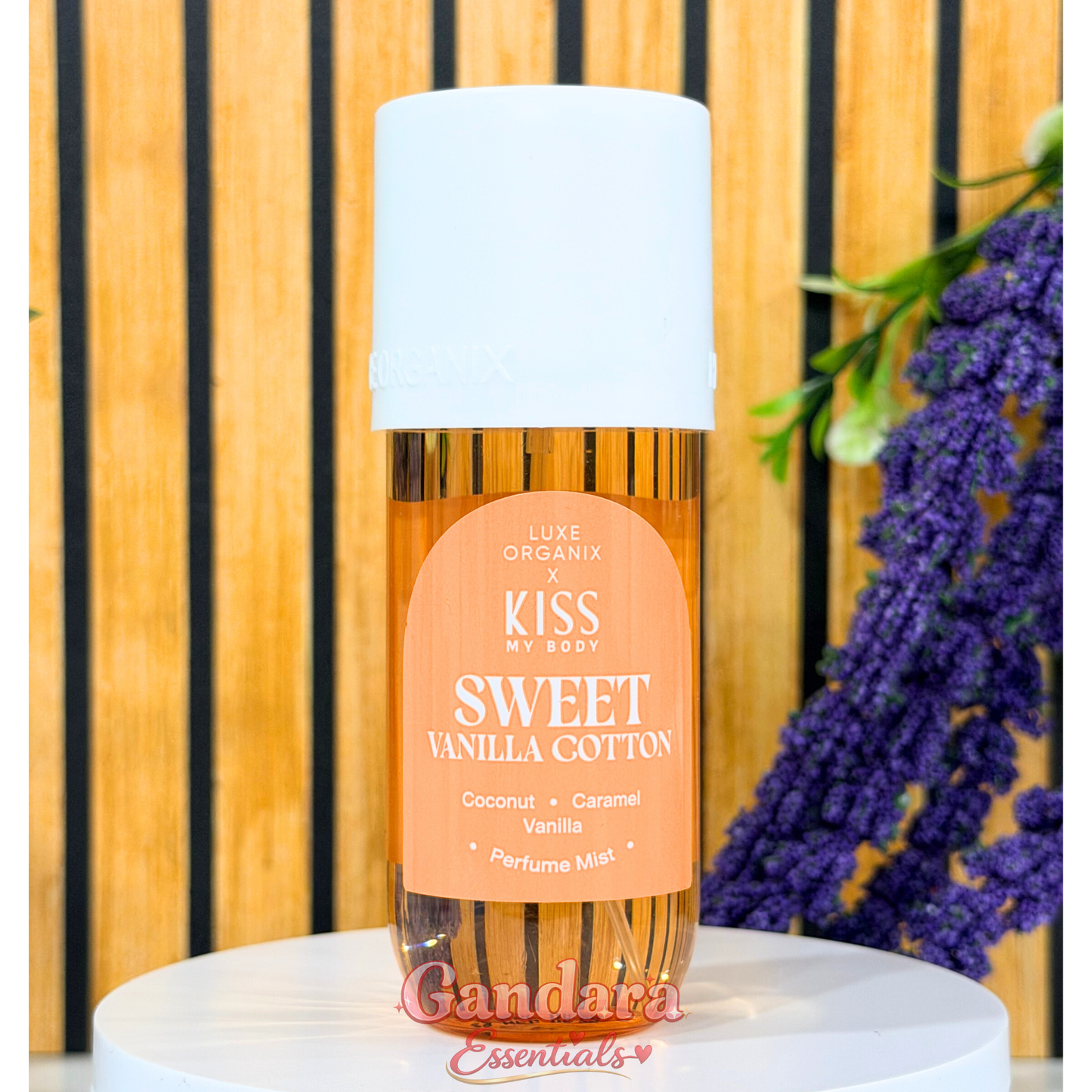 Luxe Organix Kiss my Body Sweet Vanilla Cotton Perfume Mist bottle with a soft, floral design against a neutral background.